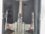 a box with a model of a fighter jet in it