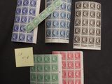 four different types of postage stamps on a black background