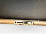 a close up of a baseball bat sitting on top of a table