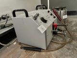 a machine that is sitting on the floor in a room