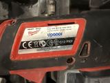 an image of a close up of a red and black power tool
