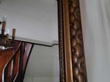 a mirror that is hanging on the wall in the room