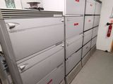 a lot of lockers in a room with a lot of drawers