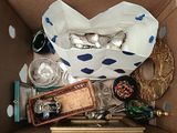 a box full of silverware and other items in it