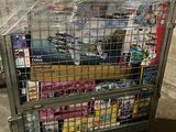 a metal cart with many items in it in a warehouse
