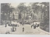 a black and white photo of a horse drawn carriage on a street