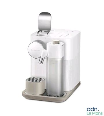 an image of a white coffee machine with a cup of coffee