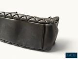 an image of a black purse on a white background