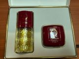 an image of a bottle of perfume next to a box