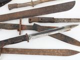 many different types of old knives on a white surface