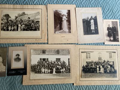 several old black and white photographs of people in formal clothes