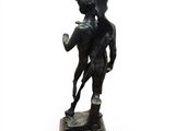 statue of a man holding a woman on his back