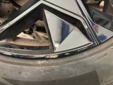 a close up of a car tire with a star emblem on it