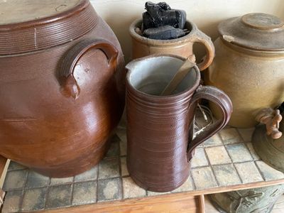 many different types of pottery on display in this room