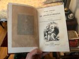 a person holding an open book in their hand