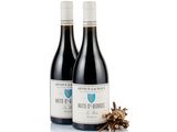 two bottles of wine sitting next to each other on a white surface