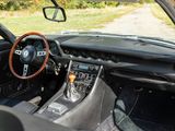 a dashboard and steering wheel of a sports car