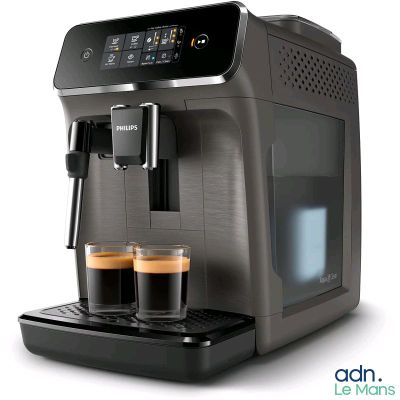 the coffee machine has two cups of coffee in front of it
