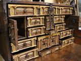 a large wooden chest with many drawers on it