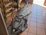 a umbrella that is laying on the floor of a restaurant