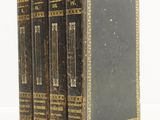 an old book set of three books sitting on top of each other