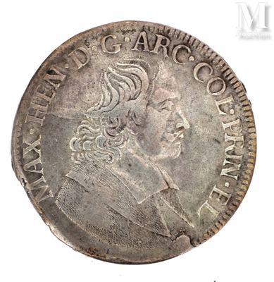a close up of a silver coin with a man ' s face on it