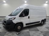 the white van is parked on a checkered tile floor
