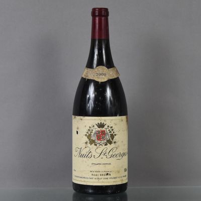 a bottle of wine that is sitting on a table
