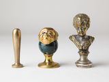 three figurines that are sitting next to each other