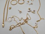 a collection of gold jewellery including rings, bracelets, and rings