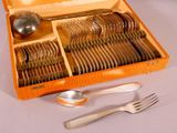 a wooden box with silverware in it on a table