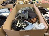 many boxes of clothes that are sitting on the floor