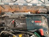 a close up of a drill and other tools in a box