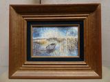 a picture of a painting of a boat on a table