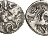 a silver coin with a horse and rider on it
