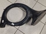 an image of a black horn on a tile floor