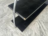 an image of a black shelf with two shelves on it