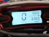 a close up of a motorcycle with a speedometer on it