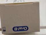 a box of toothbrushes sitting on top of a counter