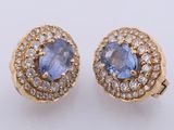 a pair of tanzane and white topaze earrings