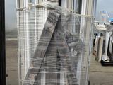a large stack of metal poles on a pallet