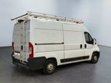 a white van that is parked in a room