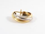 a close up of a pair of gold and silver hoop earrings