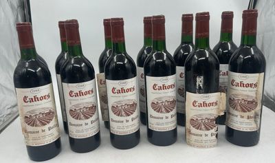 six bottles of wine are lined up in a row on a table