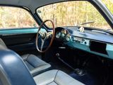 a dashboard and steering wheel of a classic car