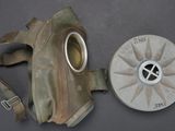 a gas mask and a gas can sitting on a table
