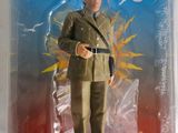 figurine représentant un homme en uniforme militaire, dans un emballage en plastique