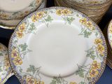 a lot of plates that are sitting on a table