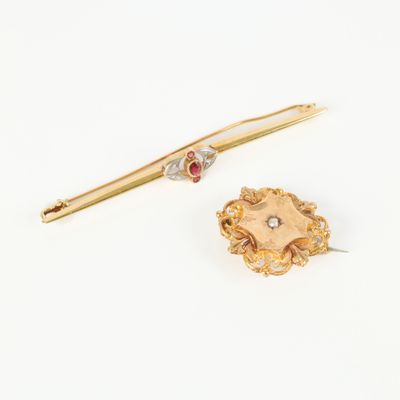 two gold and diamond brooches and a gold pin