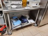 a metal shelf with a bunch of items on top of it